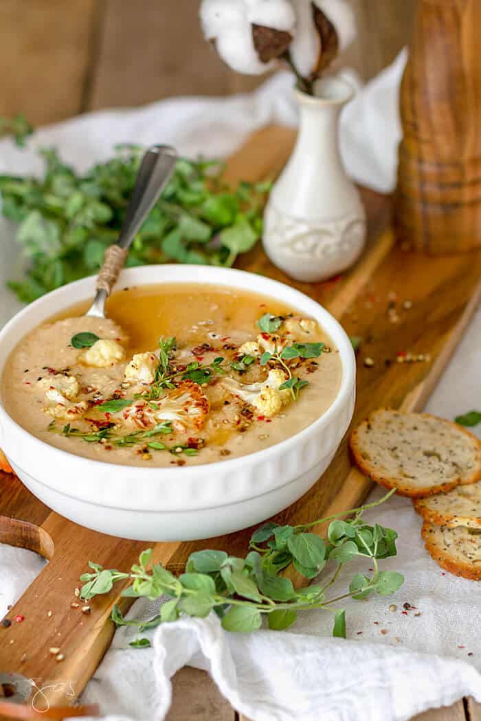 Charr roasted cauliflower are mashed and cooked into a delicious soup. 