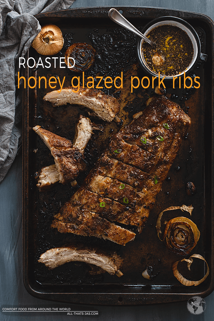 Glazed pork ribs on a pan with text