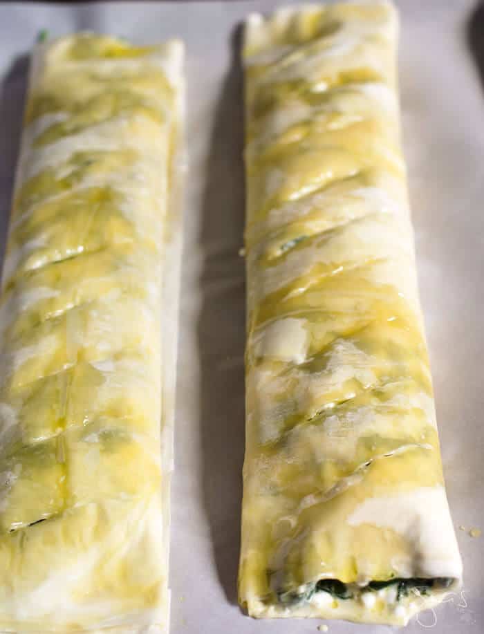 The filo logs stuffed with spinach and cheese are ready for baking