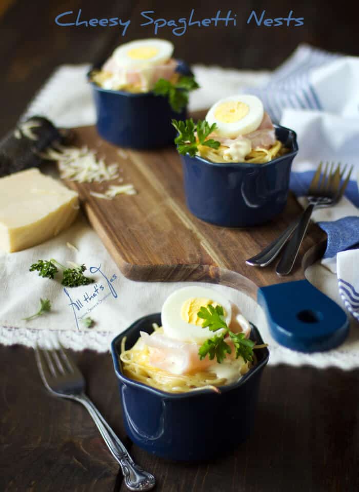 Ramekins with spaghetti and eggs on a table