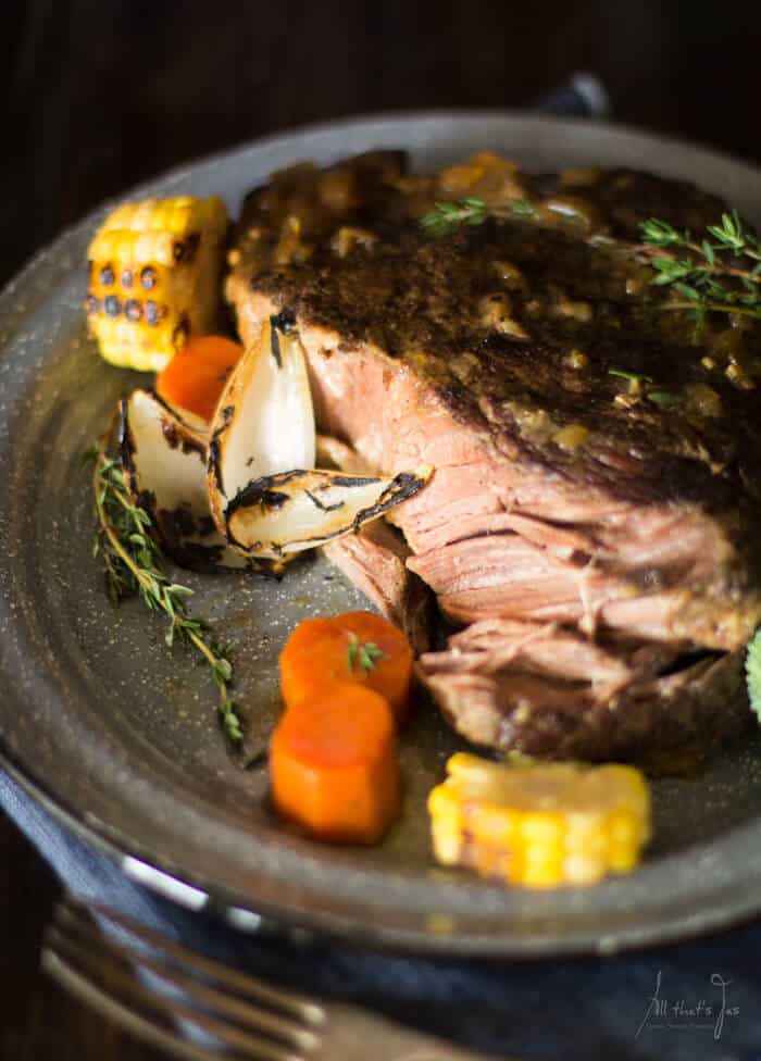 Roasted carrots, onions and corn pair well with this roasted pot roast. 
