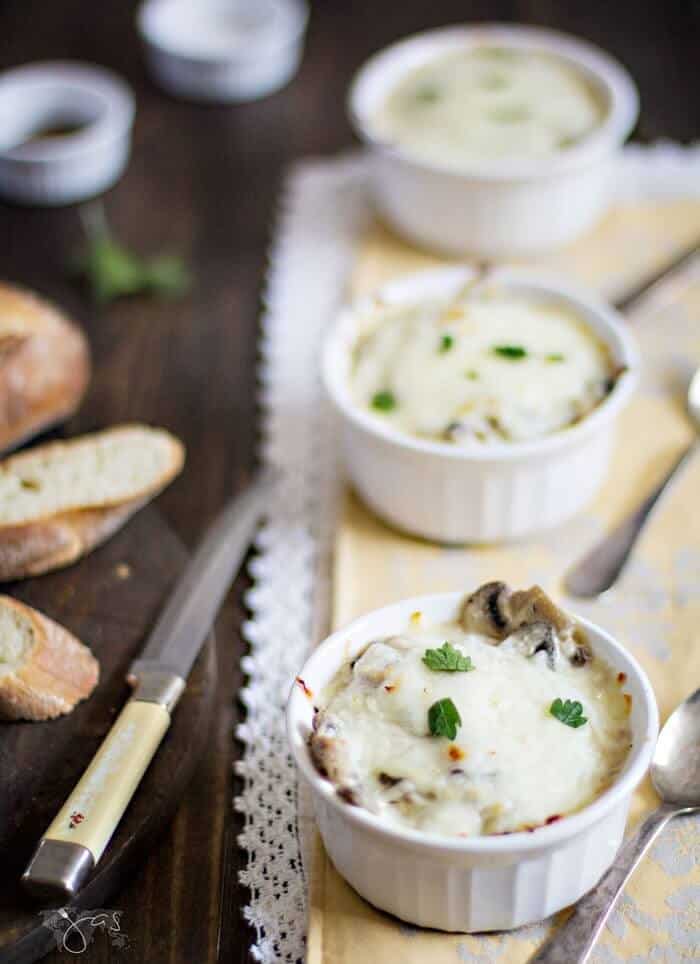 These creamy mushroom appetizers served in mini ceramic dishes look tasty. 