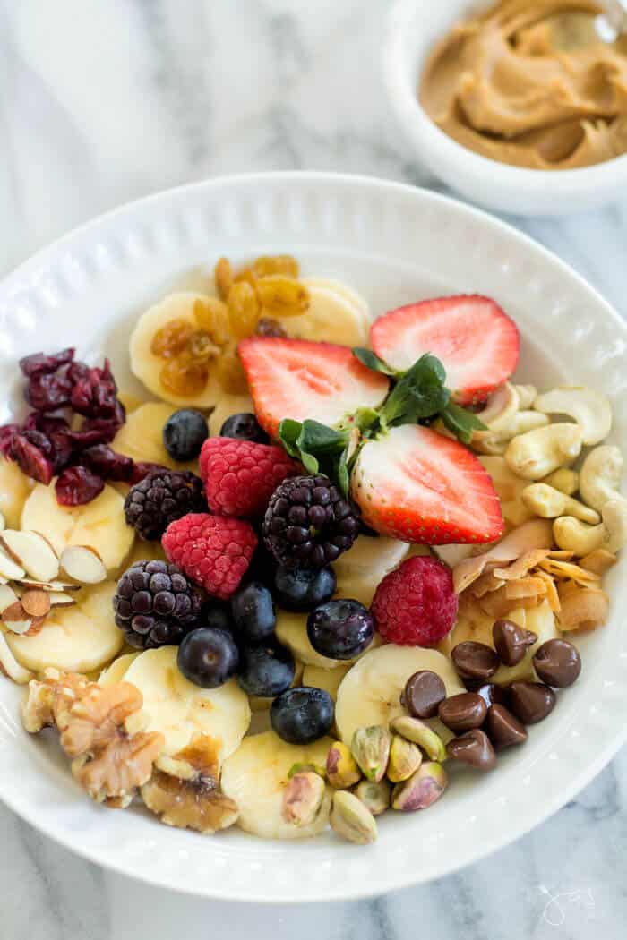 This fruit and nuts monkey breakfast bowl is loaded with nutritious ingredients and it's a healthy option that adults and kids can agree upon.