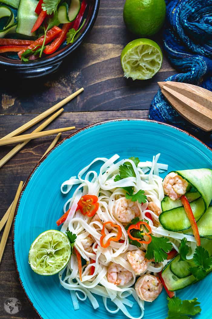 Plated Thai noodle salad with cucumbers and red peppers.
