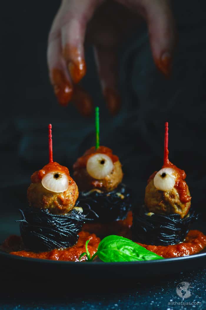 black spaghetti nests with eyeball meatballs for Halloween