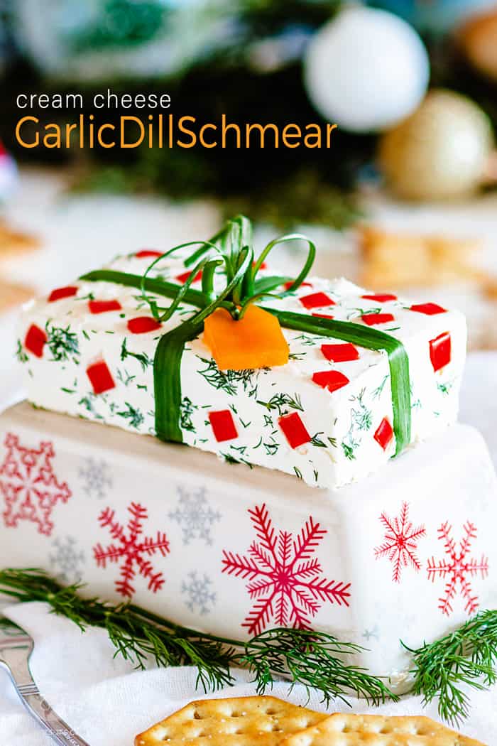 Festive garlic dill cream cheese schmear wrapped like a Christmas gift